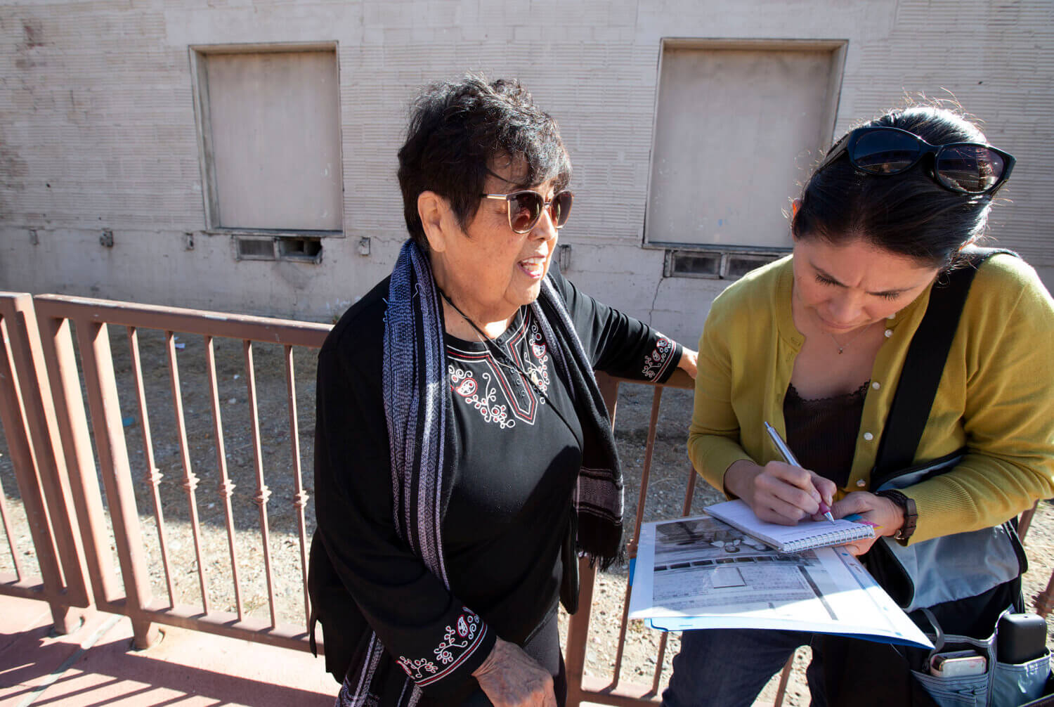 Yvette Cabrera interviewing Mary Garcia in Santa Ana, 2019.
